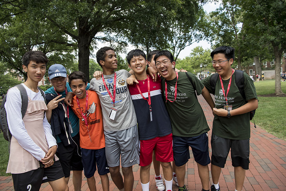 A group of male CTY on-campus programs students standing outside at Johns Hopkins university