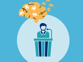 Cartoon image of a person sitting at a witness stand with a cartoon brain and puzzle pieces above.