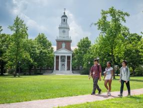 Three older CTY students walking outside on the Johns Hopkins University campus