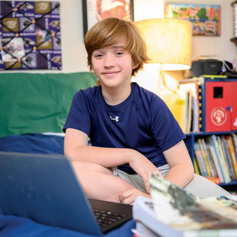 CTY student in his home with laptop